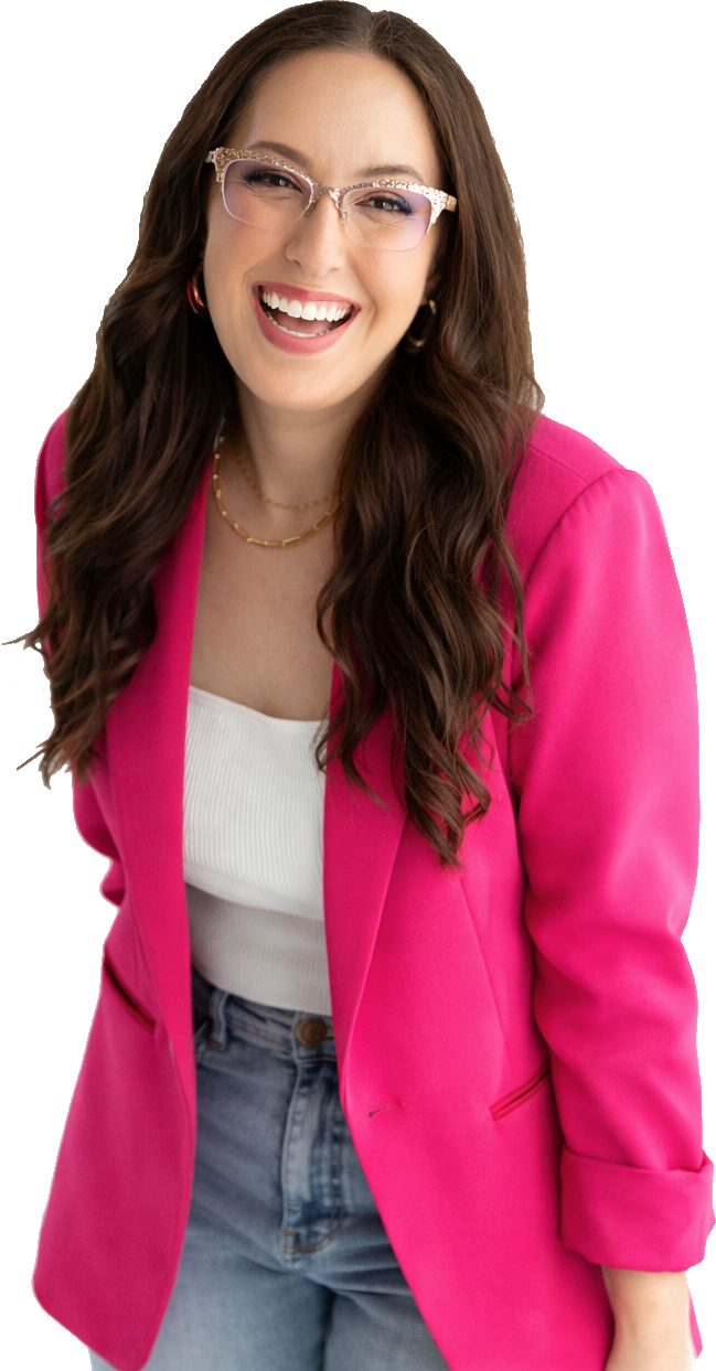 A smiling young woman in a bright pink blazer